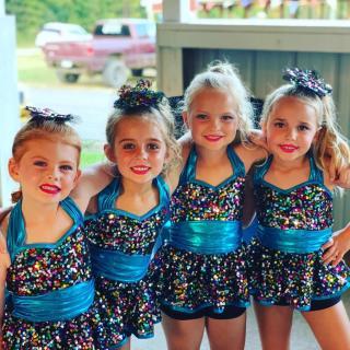 Little girls in costume at County Fair 