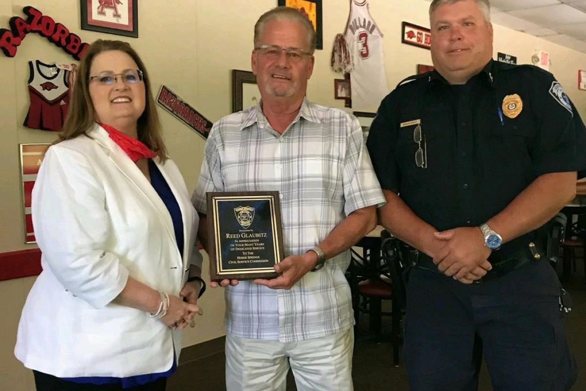Reed Glaubitz was presented with a plaque for his many years of dedicated service with the Heber Springs Civil Service Commissio