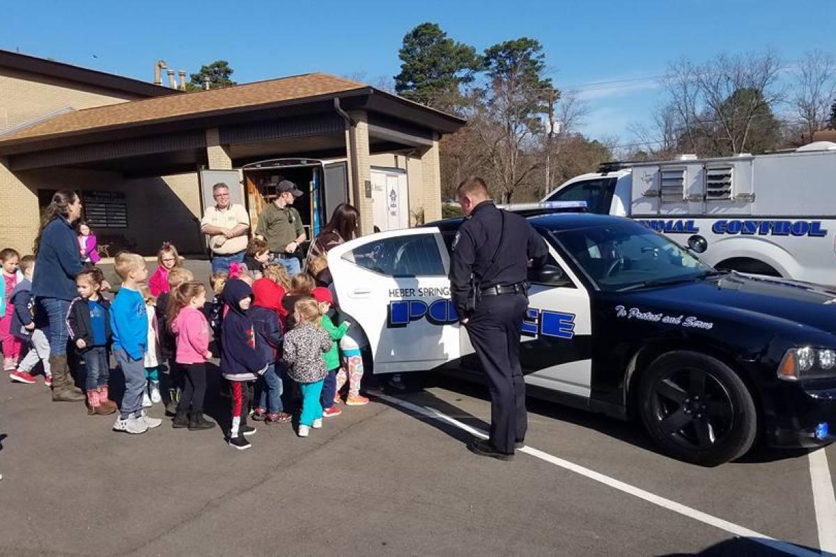 Police Officers visiting school and showing off Police car