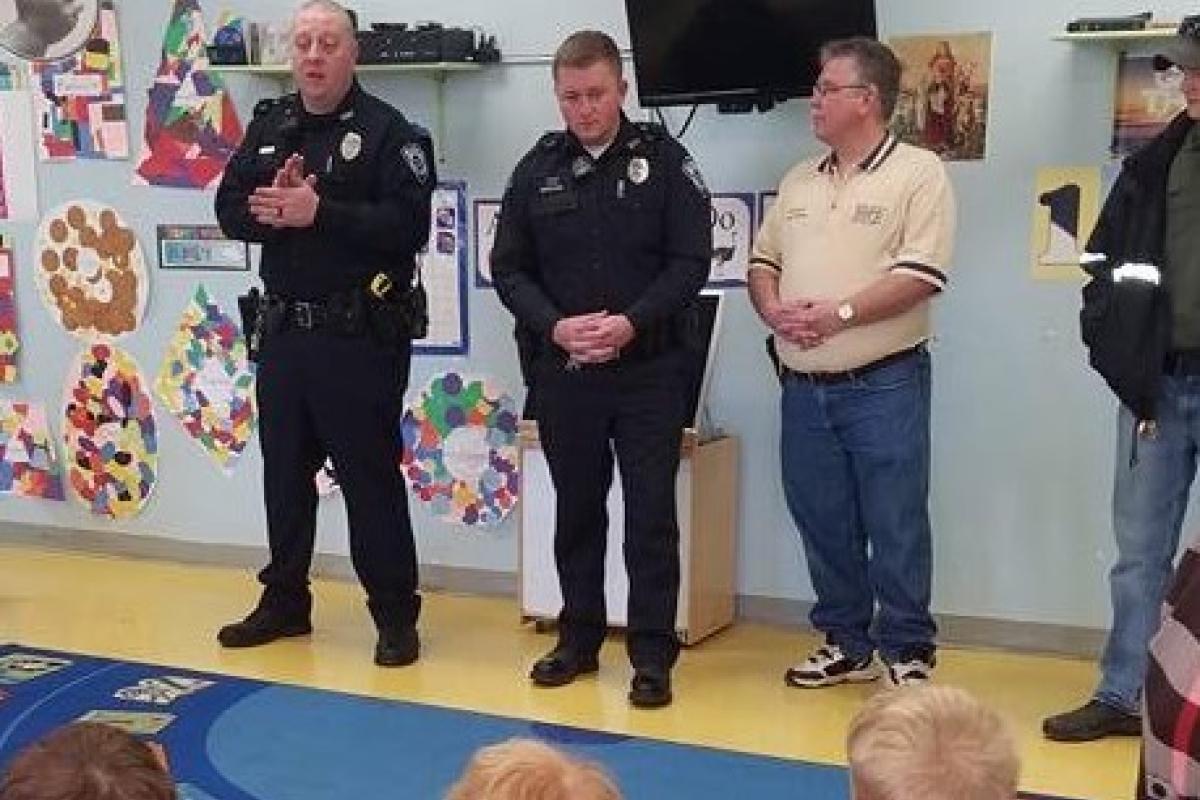 Police visiting with kids at school.